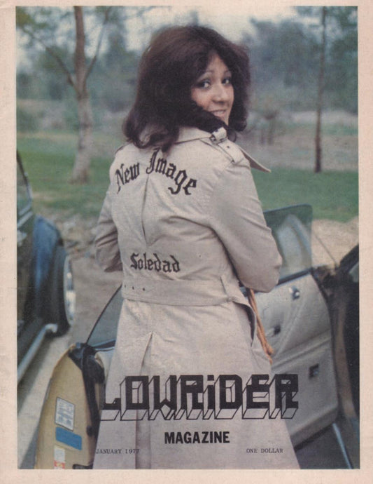 Lowrider Chicano Magazine featuring young hispanic lady on front in front of lowrider car.